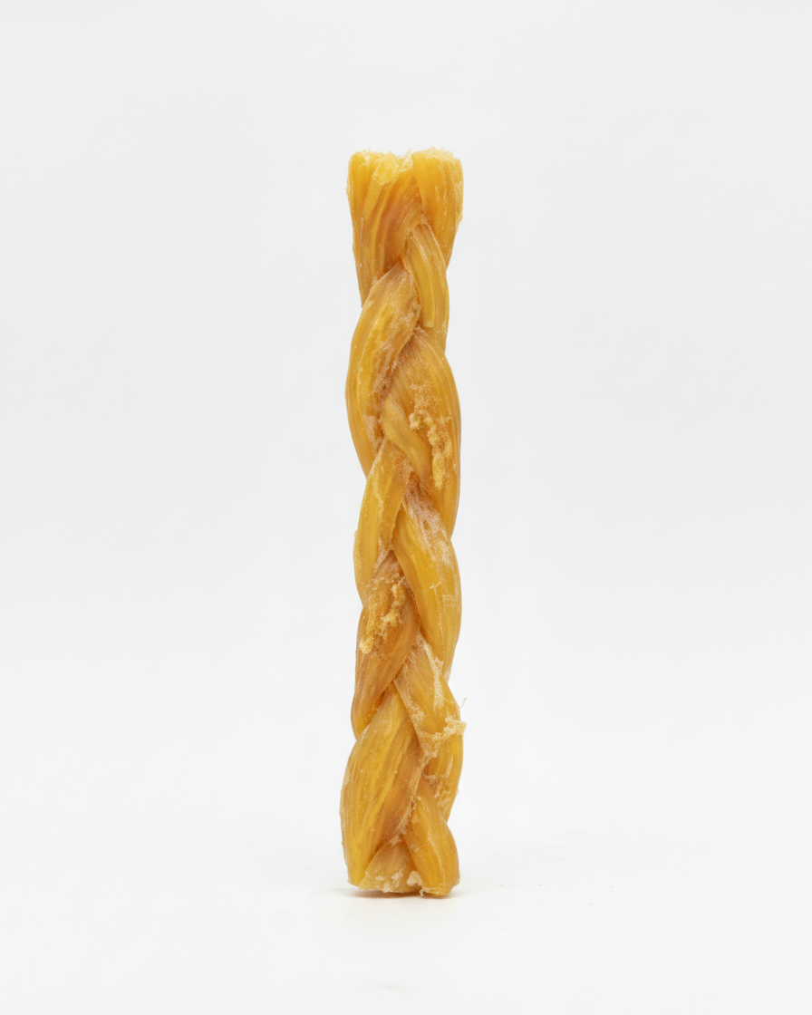 Braided beef backstrap dog chew on white background